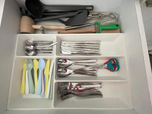 a drawer filled with lots of utensils at BELI KAMEN Vikendica in Besenovacki Prnjavor