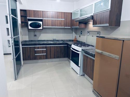 Η κουζίνα ή μικρή κουζίνα στο Cómodo Departamento