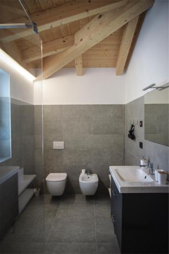 a bathroom with a toilet and a sink at Villa Bazza in Riva del Garda