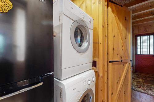 a washer and dryer stacked on top of each other at Built with Love in Bolton Landing