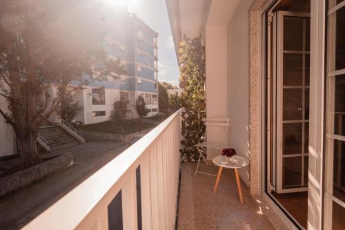 a balcony with a view of a building at Houses São Pedro in São João da Pesqueira