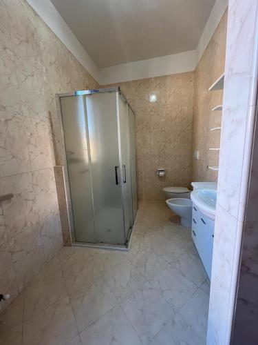 a bathroom with a shower and a toilet at Il Sogno in Senigallia