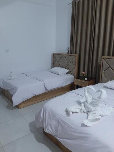 מיטה או מיטות בחדר ב-Panorama Hotel