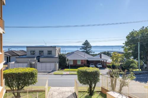 arial view of a residential neighbourhood with houses at Yarramundi, 7-47 Magnus St - spectacular views in the heart of Nelson Bay in Nelson Bay