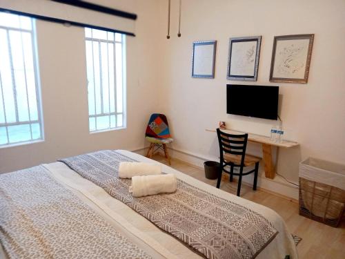 En eller flere senge i et værelse på CONDESA Host 3