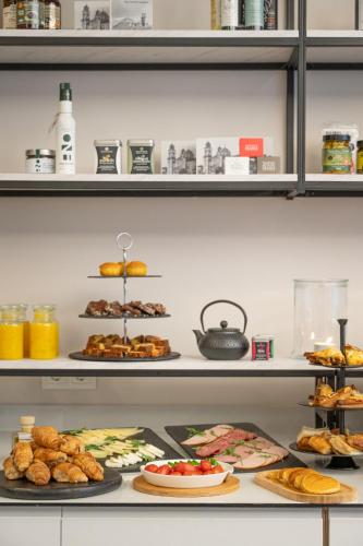 a buffet with many different types of food on display at IRA - ΗΡΑ Hotel in Kalamata