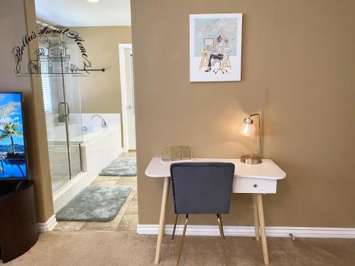 a desk and a chair in a room with a bathroom at Bella's sweet house 5640 in Eastvale