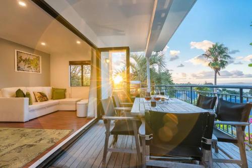 a living room with a couch and a table at 2 Levels of Magnificient Sea Views in Palm Beach