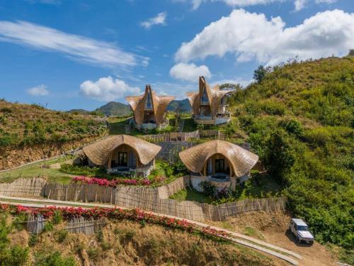 an aerial view of a house on a hill at Villa Grazia - Anima Eco Lodge -Ville Lussuose con Piscina Vista Mare in Selong Belanak