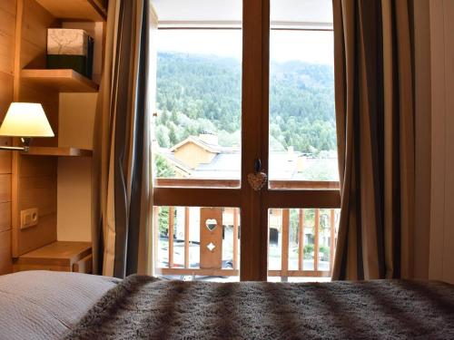 Appartement familial 12 pers. avec balcon, cheminée, proche pistes et commerces à Méribel