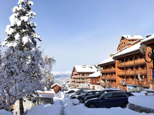 Appartement familial 12 pers. avec balcon, cheminée, proche pistes et commerces à Méribel