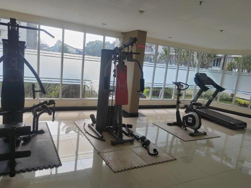 a gym with two tread machines in a building at 温馨小屋18 in Bandung