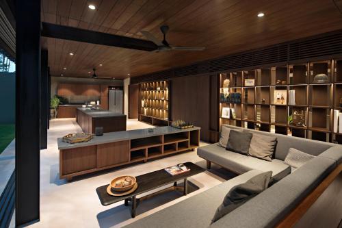 a living room with a couch and a table at Awrawikara by REJA Reserve in Bogor