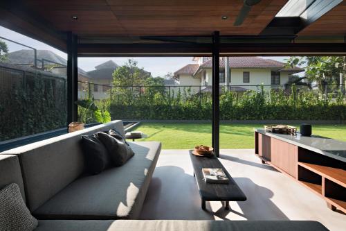 a living room with a couch and a table at Awrawikara by REJA Reserve in Bogor