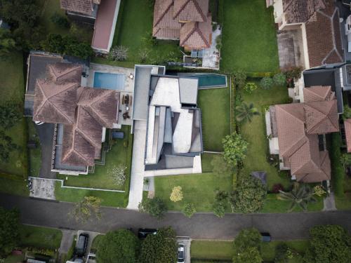 an overhead view of a house with a yard at Awrawikara by REJA Reserve in Bogor