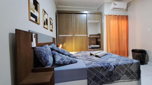 Ένα ή περισσότερα κρεβάτια σε δωμάτιο στο Casa ampla e agradável com piscina e churrasqueira