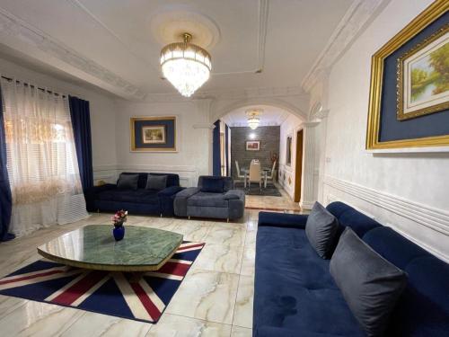 a living room with a couch and a table at Residence Seka in Mbalngong