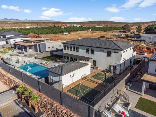 an aerial view of a house with a swimming pool at Pecan Valley Oasis - Lux Pool, Sauna and Theater in Hurricane