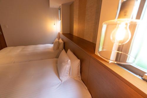 Katil atau katil-katil dalam bilik di Pool Villa Kouri Island by Coldio Smart Resort