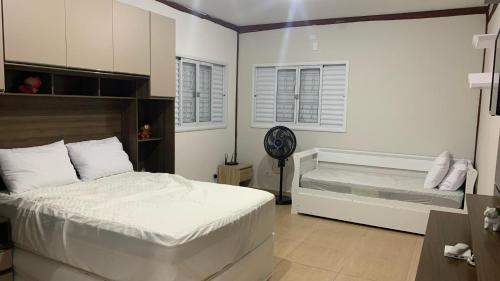 Ένα ή περισσότερα κρεβάτια σε δωμάτιο στο Chácara Festeja - Casa de Campo