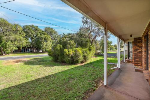 an empty porch of a house with a yard at Seaside Getaway in Dunsborough