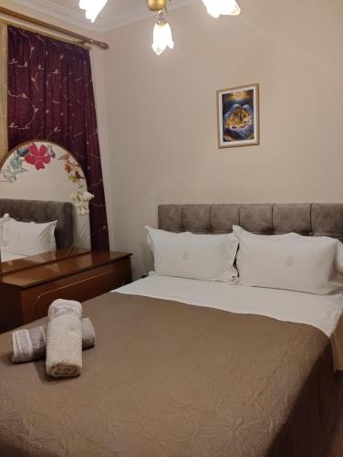 a bedroom with a bed with a stuffed animal on it at Linda's apartment in Agia Triada