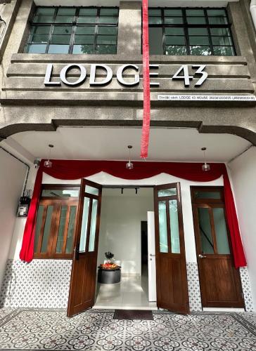 a building with the number on the side of it at Lodge 43 House in George Town