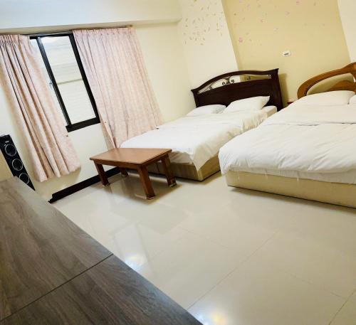 Ein Bett oder Betten in einem Zimmer der Unterkunft 民宿記 Min su ji