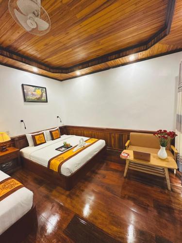 Luang Prabang Oudomlith Villa & Travelにあるベッド