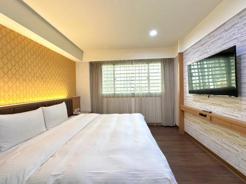 Postel nebo postele na pokoji v ubytování Mei Hotel
