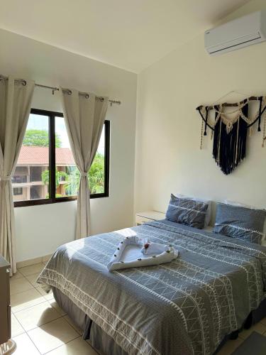 a bedroom with a bed with a tub on it at Coral Reef Condo in Coco