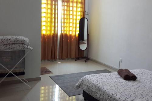 Letto o letti in una camera di Oh My Melaka Homestay