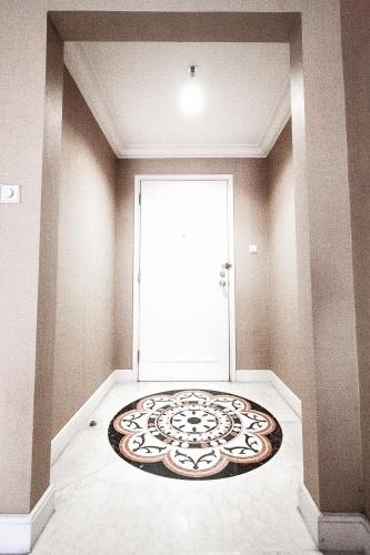 a room with a door with a rug on the floor at Batavia Apartment ST in Jakarta