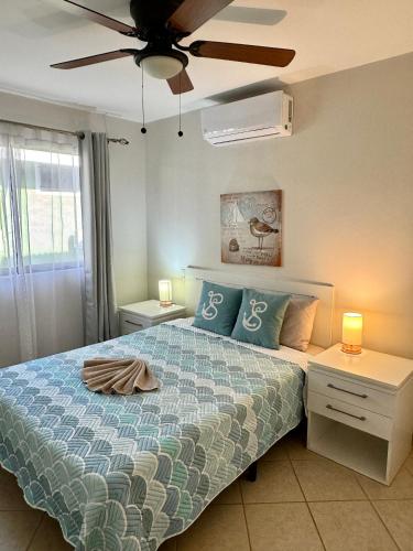a bedroom with a bed and a ceiling fan at High Tide 2 bed1 bath condo Terrace in Coco