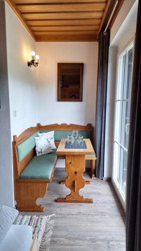 a living room with a couch and a table at Haus Ackerer in Leogang