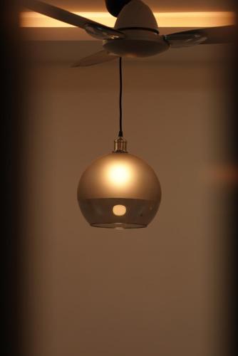 a ceiling fan hanging from a ceiling at N Cube Serviced Apartments in Hyderabad