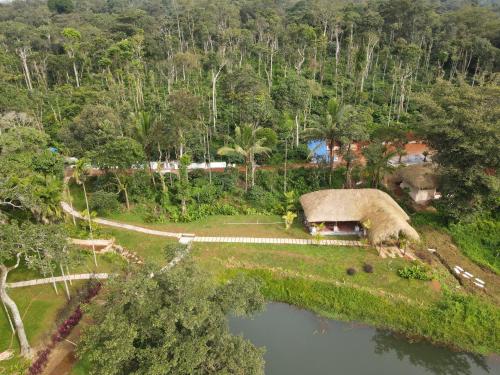an aerial view of a house on an island at The Windchimes Retreat Coorg in Virajpet