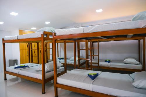 a group of bunk beds in a room at Hangout Haven Siargao Homestay in Dapa