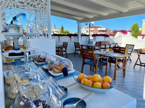 a table with bowls of food on top of a patio at Casa Dolce Casa Ruvo Breakfast & bed in Ruvo di Puglia