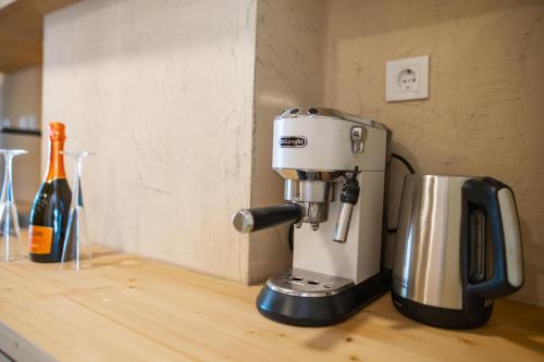a mixer on a counter with a bottle of wine at Li Mango in Tigaki