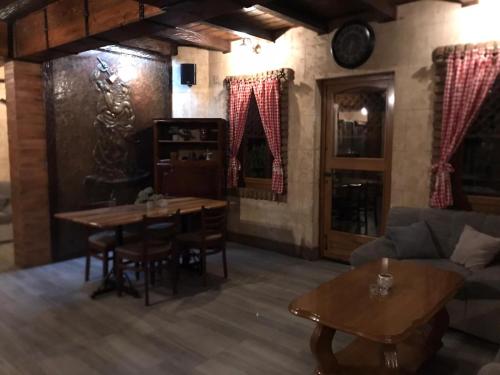 a living room with a couch and a table at Apartman dado in Bosanska Gradiška