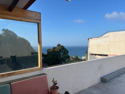 a balcony with a view of the ocean at Casa Elsa Ceuta in Ceuta