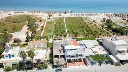 an aerial view of a beach and buildings at Li Mango in Tigaki
