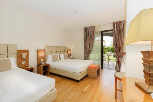 Ένα ή περισσότερα κρεβάτια σε δωμάτιο στο Hotel Arena