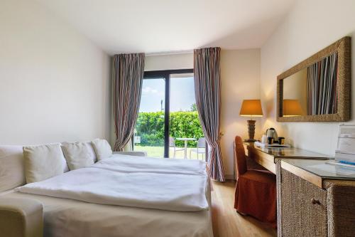Ένα ή περισσότερα κρεβάτια σε δωμάτιο στο Hotel Arena