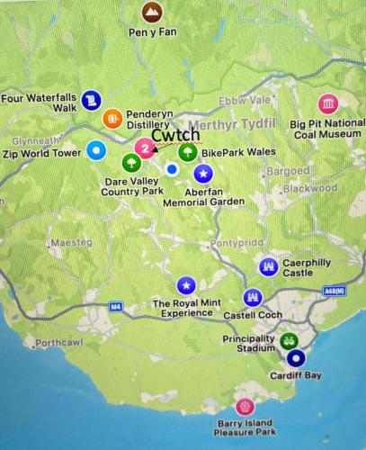 a map of the world with different places at The Cwtch, Log Fire, Sleeps 6, Nr Zip World, Brecon and Bike Park Wales in Aberdare