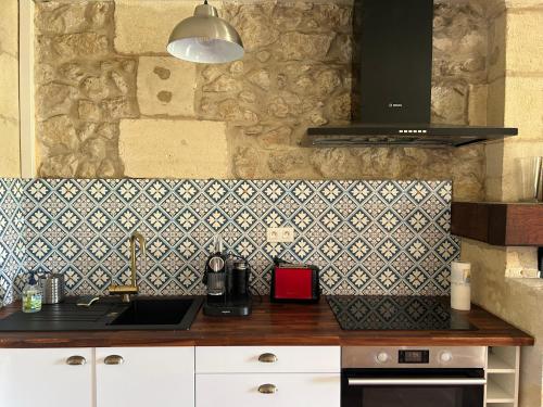 Küche/Küchenzeile in der Unterkunft La maison de l'Architecte - Gite proche Bordeaux