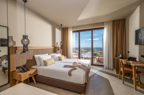 Postel nebo postele na pokoji v ubytování Hotel Pyriá