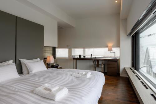 מיטה או מיטות בחדר ב-Hinzan