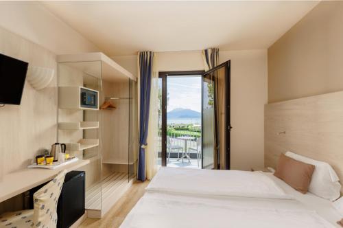 Ένα ή περισσότερα κρεβάτια σε δωμάτιο στο Hotel Arena